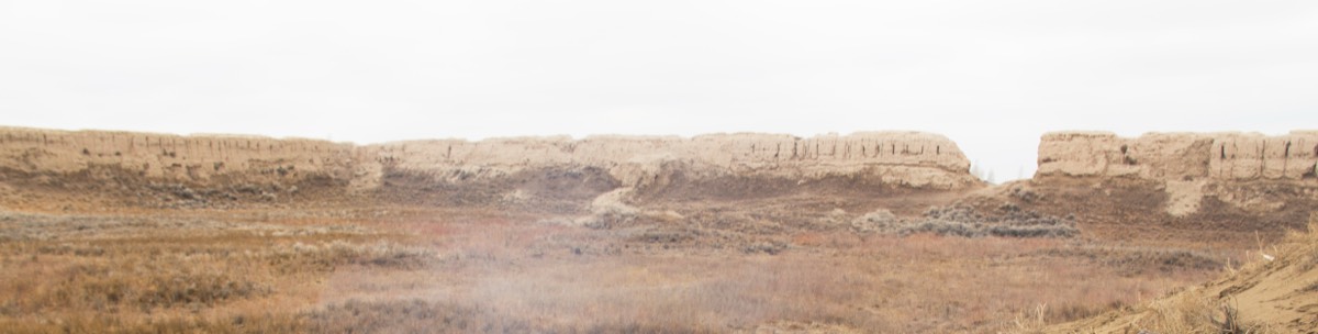 Ruined perimeter walls of the 12th-century Guldursun-Kala fortress in the Khorezm desert